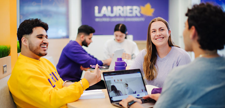 students chatting in Milton campus lounge