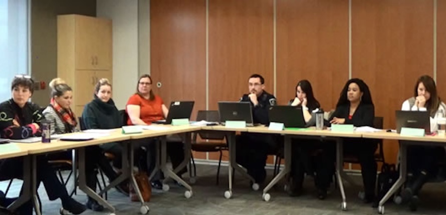 Students sitting around a table during training