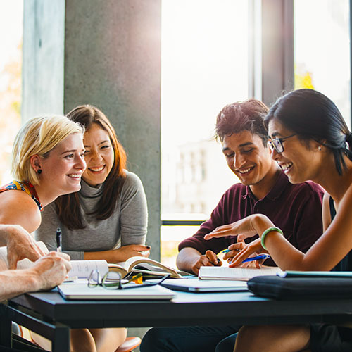 Four students doing group work.