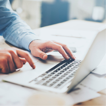 adult male working at a laptop