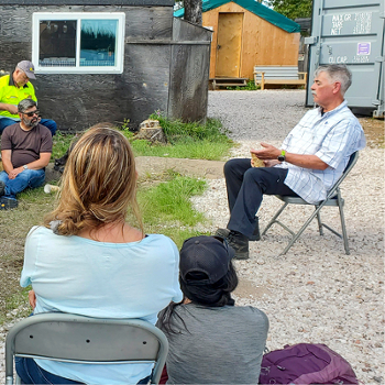 Professor Jim McGreer speaking with community members