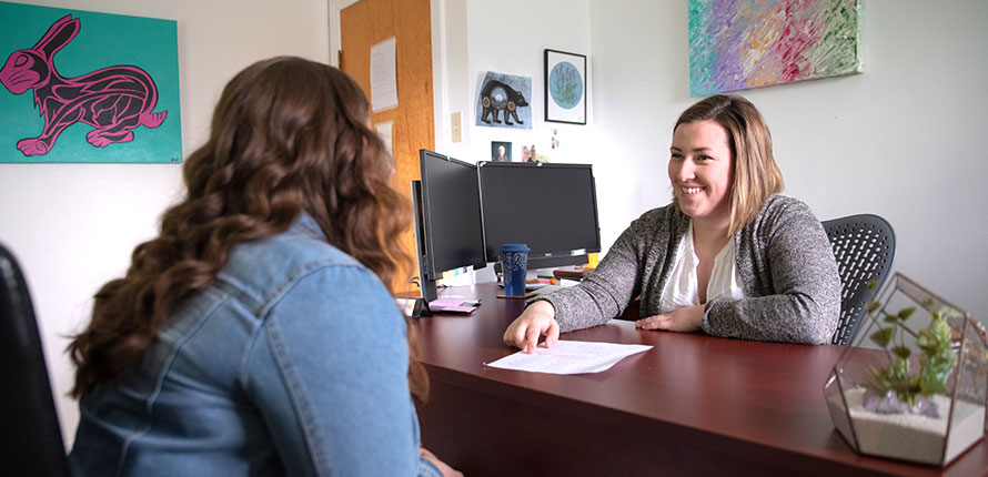 student talking to advisor