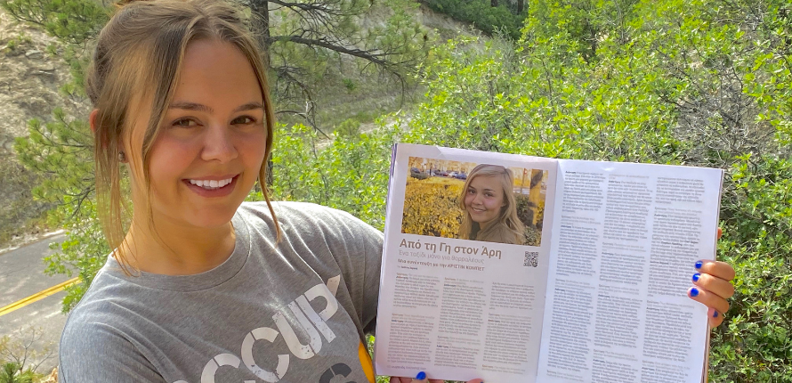 Woman holding a magazine open