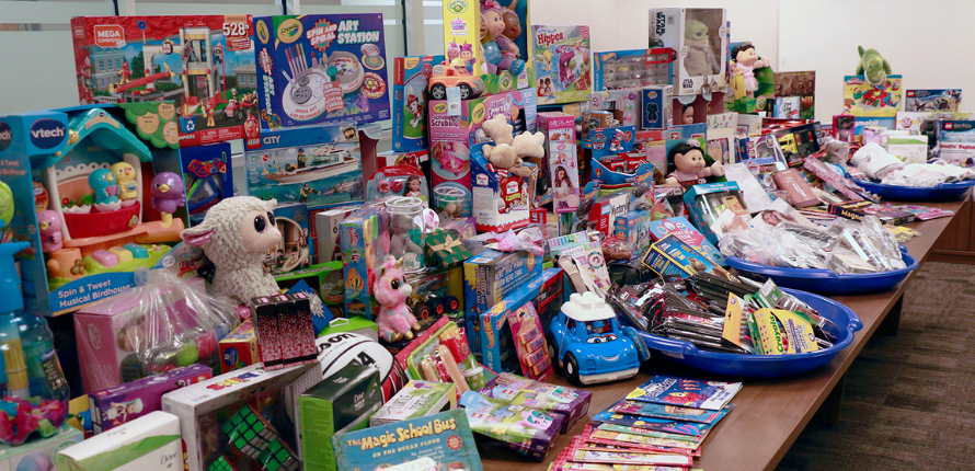 Several toys and books arranged on a table.