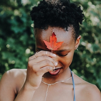 Girl holding maple leaf