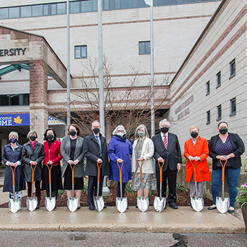 group of people at groundbreaking ceremony