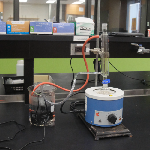 The chemistry lab’s reflux setup where water is pumped through the condenser loop and recycled. 