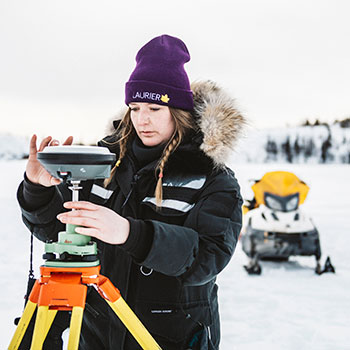 Alicia Pouw conducting research on a frozen lake