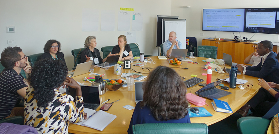 Group meeting at round table, led by Alison Blay-Palmer