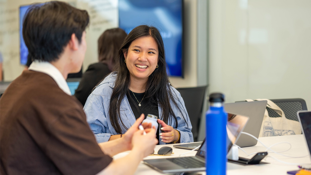 female student smiling in class